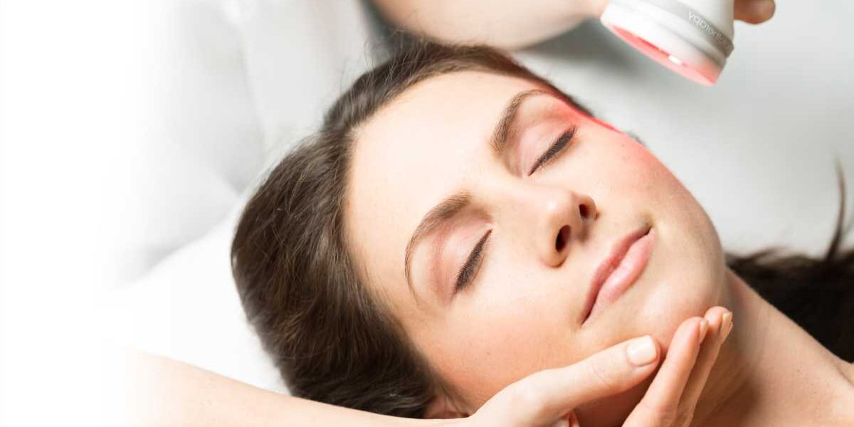 A woman getting her face washed with the help of a professional.