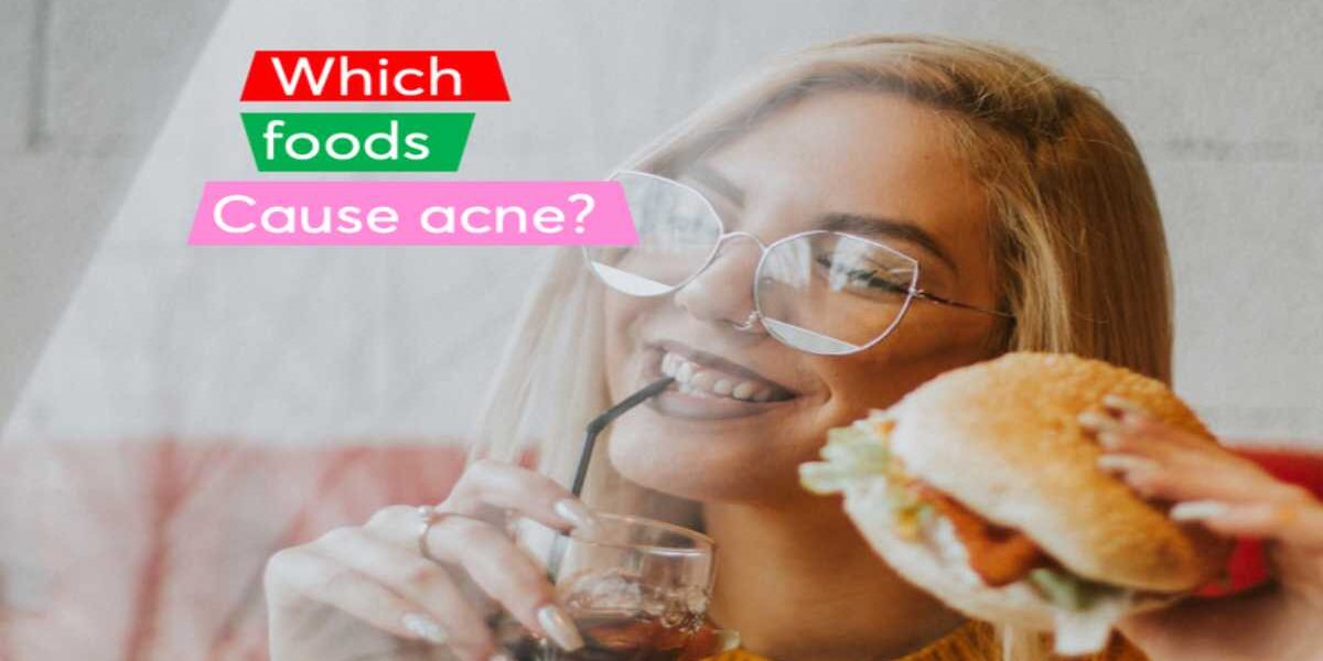 A woman holding a sandwich and drinking water.