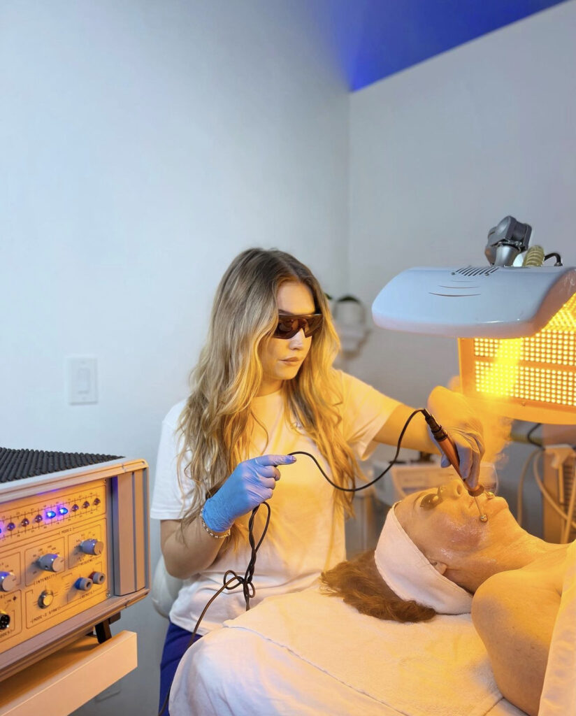 A woman is getting her hair cut at the salon
